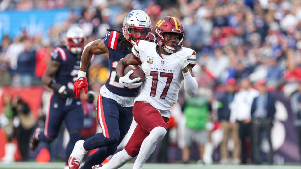 Washington Commanders receiver Terry McLaurin (17) runs the ball during the second half against the New England Patriots at Gillette Stadium.